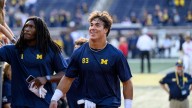 UM football players use coach Moore's absence as…
