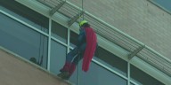 Superheroes scale windows, bring cheer to patients at American Family Children’s Hospital