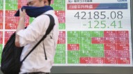 Asian benchmarks slip after US stocks sink and Japan faces political uncertainty