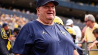 Who is coaching Michigan football vs Nebraska?