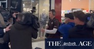 Ginnivan swarmed at Adelaide airport by media