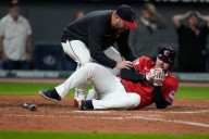 Guardians' David Fry carted off field after being hit in face by pitch while trying to bunt