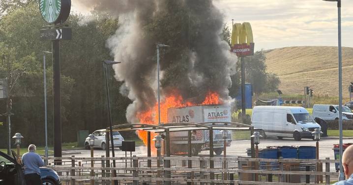 Moment blaze rips through van parked on McDonald's car park