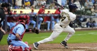 Playoff-bound Brewers rally from 5 runs down to beat Cardinals 9