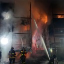 Firefighter, resident injured as fire on Centre Street in Dorchester spreads from one three decker to another