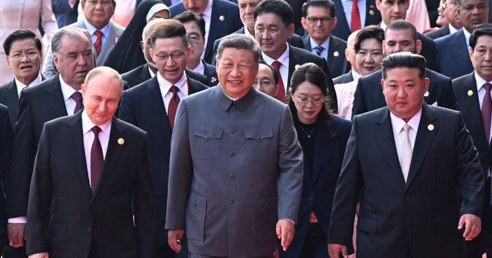 Putin grins with Kim and Xi Jinping as 'axis of evil' meet up at military parade
