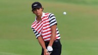 Charlie Woods, son of Tiger, hits second hole