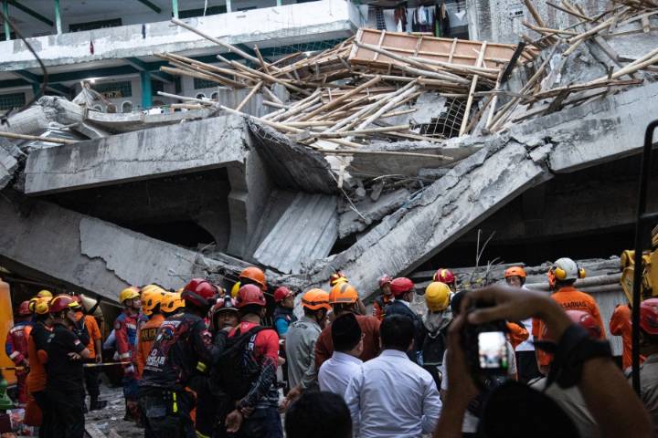'Please find my child': Video shows search for survivors in Indonesia school collapse