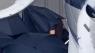 Taylor Swift Lands in California for Selena Gomez's Wedding, Covers Up With Umbrellas