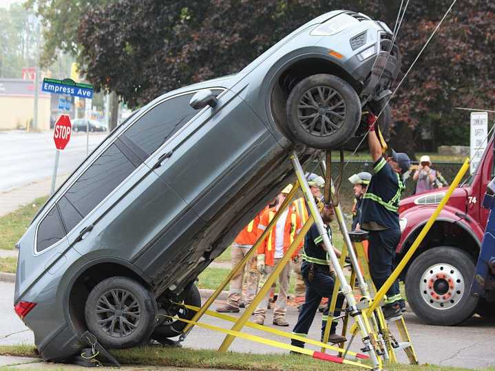 London crash leaves SUV suspended on guy wire