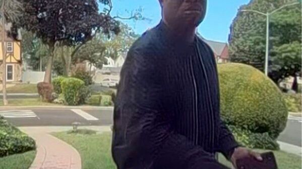 New York City police hunt for man suspected of killing elderly couple and burning their home
