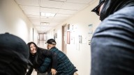 ICE officer caught on video pushing woman is placed on leave : NPR