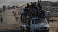 Israeli troops press forward into Gaza City as Palestinians flee