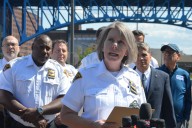 Flats shootout included rifle; two victims were facing away from shots, police say