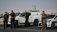 Gunman kills 2 at Israeli-run crossing between West Bank and Jordan. 4 soldiers killed in Gaza