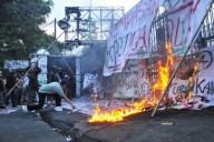 With brooms in hand as symbol for change, Indonesian women join Jakarta protests