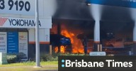 Man fighting for life after fire breaks out at Queensland tyre shop