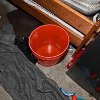 Couple charged: 6 children found in storage unit without power, water