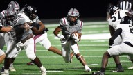 Stanhope Elmore's Damarrian Barnes runs over Smiths Station in homecoming win
