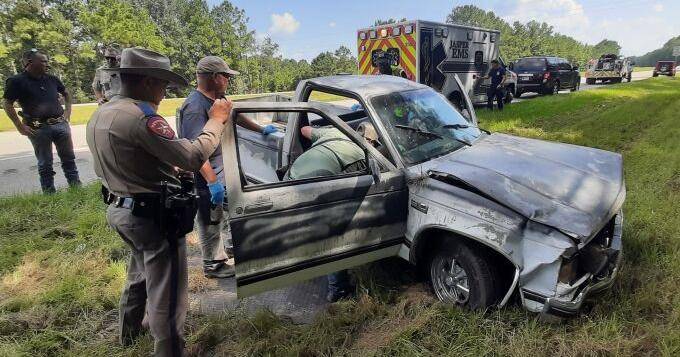 Driver injured when his pickup truck went off a highway and hit a tree