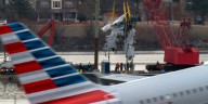 Family of one of 67 Washington plane crash victims sues the FAA, Army and American Airlines