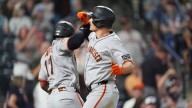 Chapman homers twice after appealing suspension to help the Giants beat the Rockies