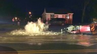 Road floods after car crashes into fire hydrant