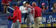 Riley Adams exits after foul tip to groin