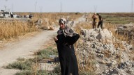 At a mass grave on the outskirts of Damascus, some families learn the fate of missing loved ones