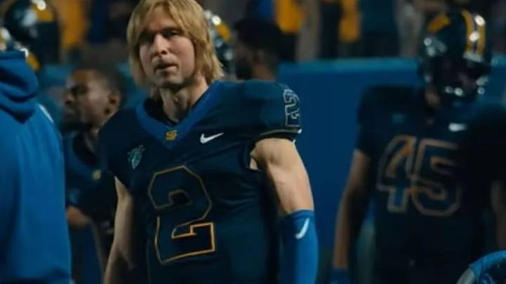 Hollywood heartthrob looks unrecognisable as shaggy-haired American football player