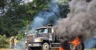 Firemen respond to burning dump truck
