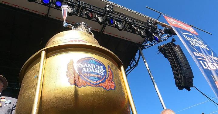 The tapping of the Golden Keg draws large crowd at Oktoberfest grounds