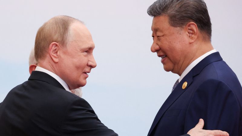 China’s Xi and Russia’s Putin sit down for formal talks in Beijing