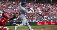 Surging Reds blank Cubs, move into tie for NL wild card spot