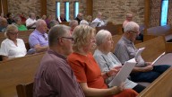 Community gathers for prayer, song after deadly church shooting in Grand Blanc Township