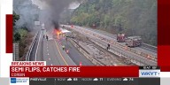 Semi flips over, catches fire on I