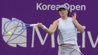 Swiatek battles back to win Korea Open