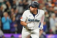 Mariners clinch playoff berth, beating Rockies 4