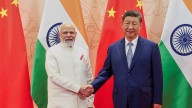 China's Xi and India's Modi vow to resolve border differences at a meeting in Tianjin