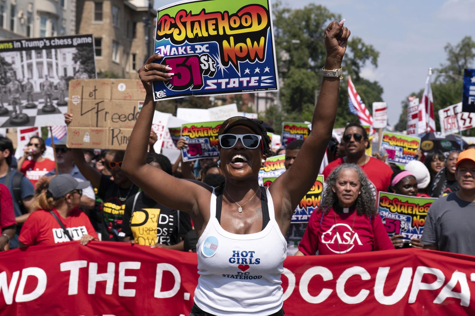 Thousands protest for a 'Free DC' on the fourth week of federal control in Washington