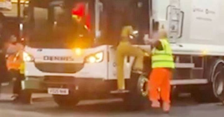 Video shows woman ripping wipers off bin lorry and swinging at workers in bizarre attack