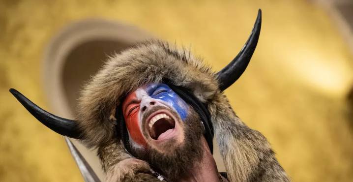 QAnon Shaman says he’s rightful president, sues Trump for $40 trillion