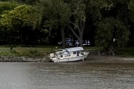 Authorities work with boat owner to get beached craft off Harriet Island