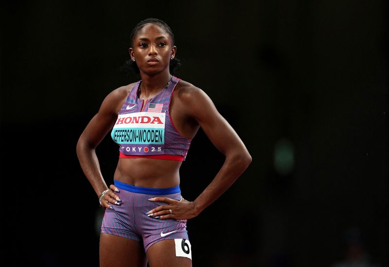 Athletics-Jefferson-Wooden and Alfred cruise through 100 metres heats