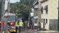 4 firefighters injured by power line while battling South Side Slopes fire
