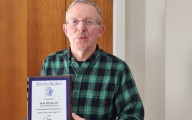 Retiring swim coach thought Belfast would be a quick stop. He ended up staying for 52 seasons.