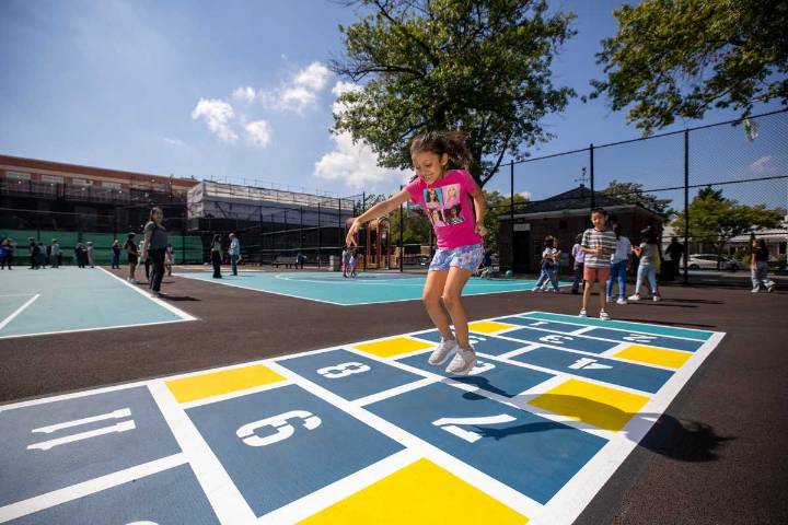 Local students celebrate restoration of Queens Valley Playground blacktop