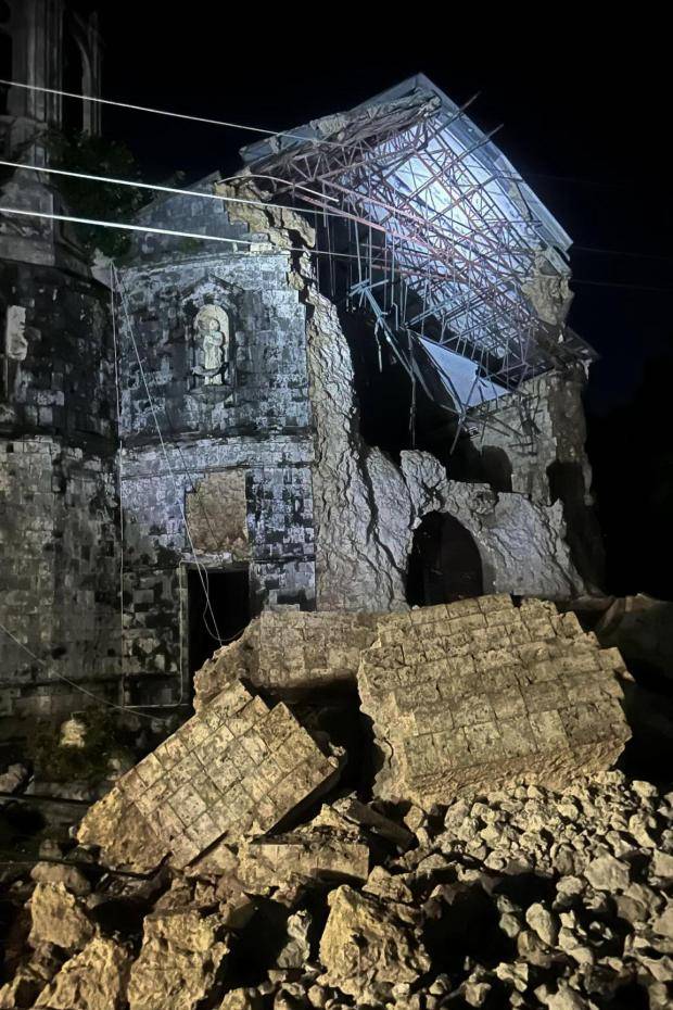Strong earthquake in central Philippines kills at least 6 people and damages houses and buildings