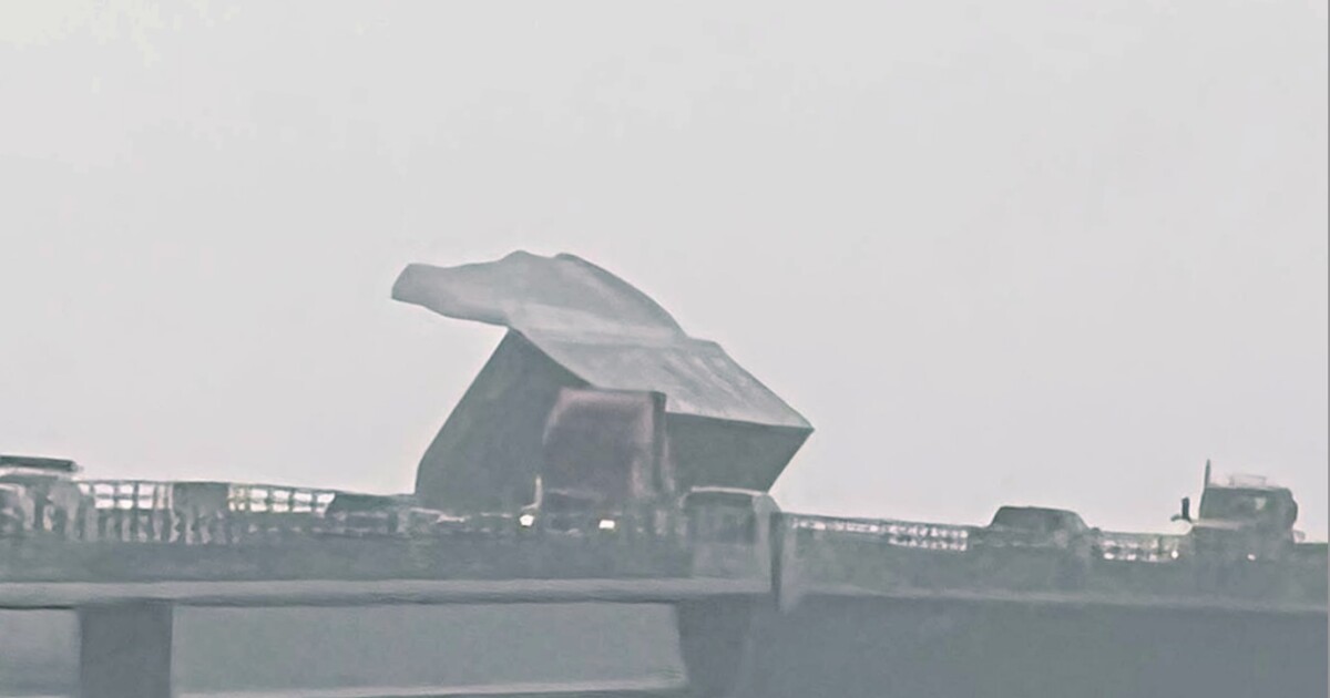 Modular home blown off trailer on Basnight Bridge