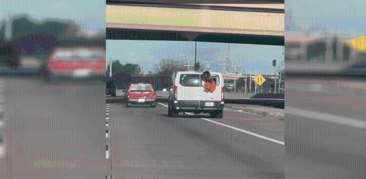 WATCH: Inmate hangs out of van on Oklahoma highway